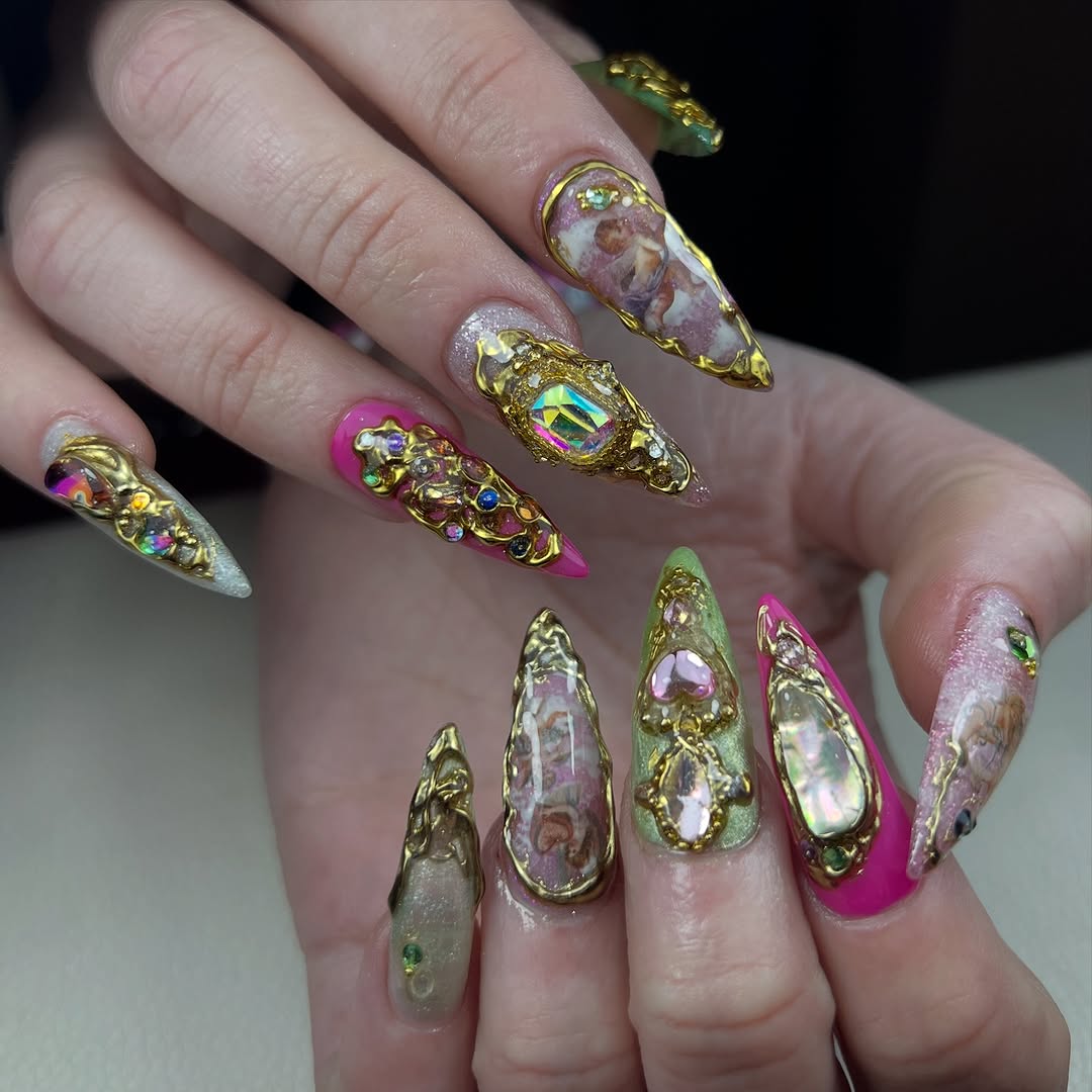 Elaborate gold and gemstone nail art
