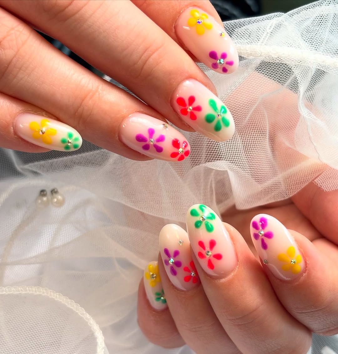 Colourful flower nail art with crystals